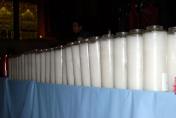 Unlit candles prior to the memorial mass. (Photo courtesy of Robin Rix and Carol Scharlau)