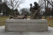 In the middle of the Holy Innocents Section of the Queen of Heaven Cemetery is a statue of Christ surrounded by little children. This view is looking away from the OLA memorial, which about about fifty feet behind this location.