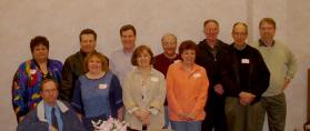 A group of survivors of the OLA fire met on March 28, 2003. For some, it was the first time seeing former classmates in over 40 years. Their organization, <i>Friends of OLA</i>, includes survivors, their family members, and others with an interest in the Our Lady of the Angels fire. The organization was originated by Linda Maffiola in the early 1990s. They elected officers, collected donations, discussed objectives and future plans, viewed old photos, and discussed old times.<br> Back Row: Betti (Marino) Wasek, Frank Consiglio, Matt Plovanich, Andrew Lego, Tom Raymond, Jim Grosso<br>Front Row: Chuck Gerlach, Charlene (Campanale-Benza) Jancik, Luciana (Mordini) Kuziw, Johnnie (Tasmer) Fuller, John Raymond. (photo courtesty of Jason Fout)