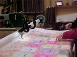 FOLA Quilt 29 (12/10/04) - Angel quilt on long arm quilting machine (Photo Courtesty of Chris Anderson)