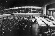 The mass funeral for 27 victims of the OLA fire, held at the Illinois National Guard Armory on Friday, December 5, 1958. An overflow crowd of parents, neighbors, friends and the curious public attended the emotional service.