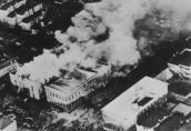 Overhead view of Our Lady of the Angels school at the height of the fire. Smoke is pouring from the roof of the north wing after firemen chopped holes in the roof to vent the intense heat and smoke. The south wing, immediately to the right of the north wing, suffered virtually no fire damage but a lot of smoke and water damage. Everyone in the south wing escaped without serious injury.