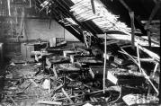 This is room 209 looking west underneath the collapsed roof. The windows are just out of view on the left. Note the teacher's desk at the front of the classroom, with her chair precariously balanced just in front of it on a pile of debris. (Life Magazine Photo)