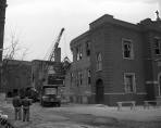 Workmen begin demolishing the burned out school early in 1959, to make way for a modern new school with all the safety features the old school lacked.