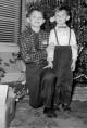 Edward Pikinski (left) and his half-brother Witold Szmyd in front of their Christmas tree in 1956 or '57. (Photo courtesy of Witold Szmyd)