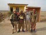 Joe Karkoszka, survivor of room 101, is a civilian contractor for the Department of the Defense doing bomb disposal work in Iraq. &ldquo;From Joe: Here is a quick shot of me and my guards here......Not the best picture in the world, but notice we are all smiling....'cause we know we got 'Saddam'&rdquo; (Photo Courtesy of Joe Karkoszka)